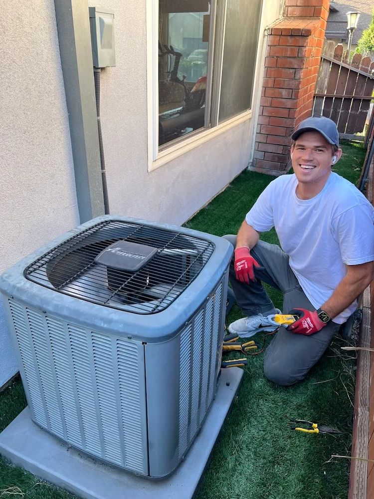 Right Way technician repairing an AC condenser in San Diego