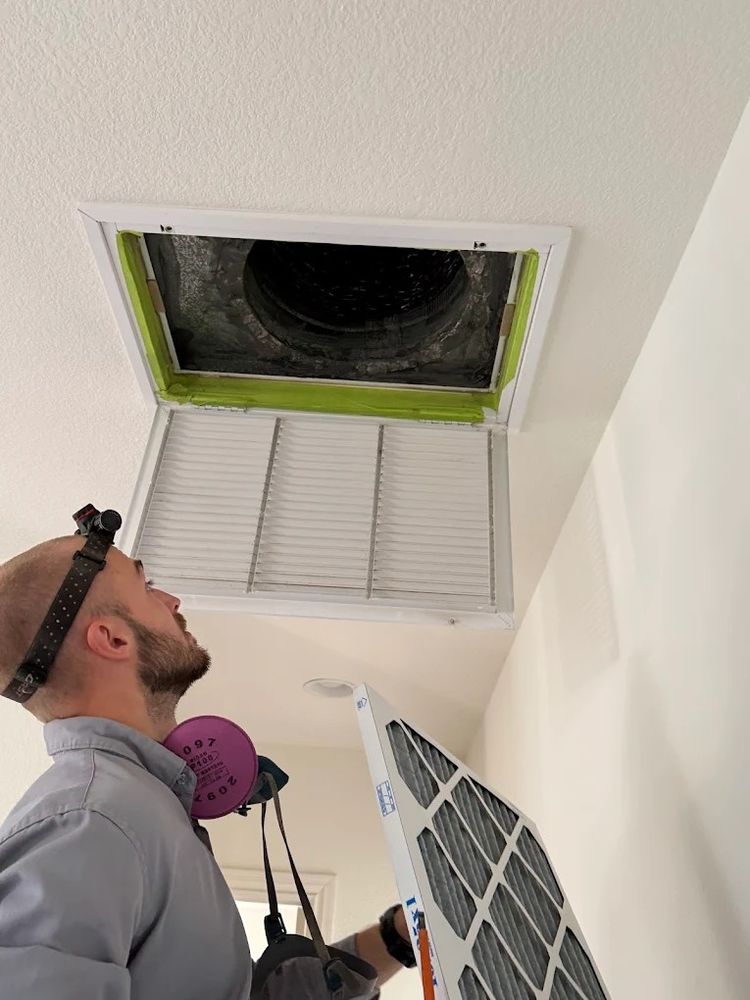 Right Way technician servicing an air handler in San Diego