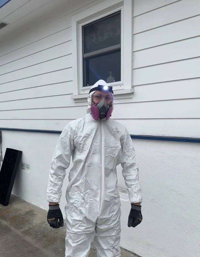 Right Way technician in protective gear for attic and insulation work